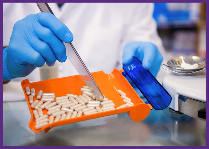 photo of a pharmacist wearing sterile gloves, counting pills to prepare a prescription 