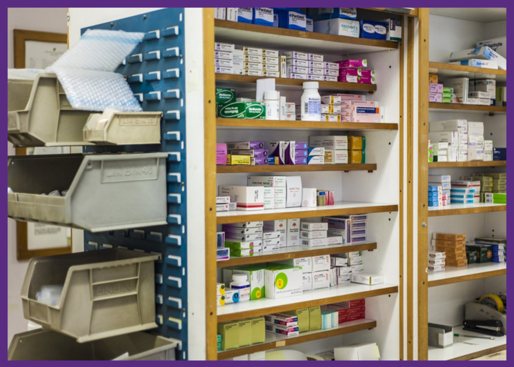 photo of shelves in a pharmacy - mistakes at the pharmacy can occur when pharmacists pick the wrong medication or wrong dosage