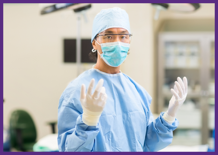 photo of a surgeon standing in an operating room