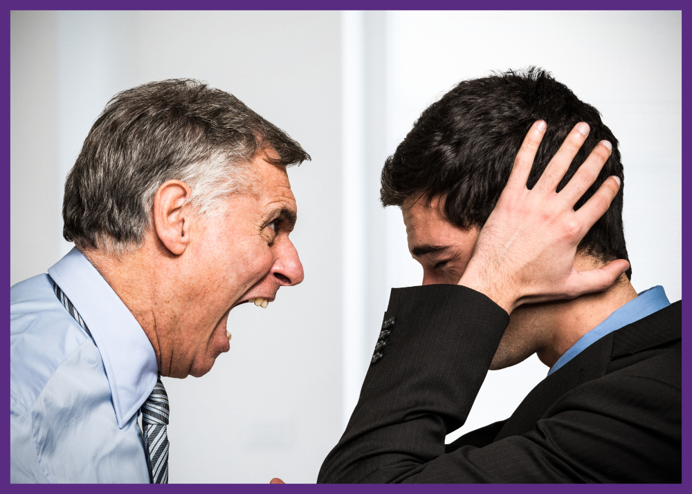 photo of a man in a shirt and tie yelling at a younger man in a suit 