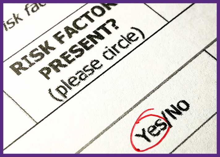 up close photo of a form that asks users to circle yes or no about risk factors - safety of surgery centers is a particular concern for patients with risk factors
