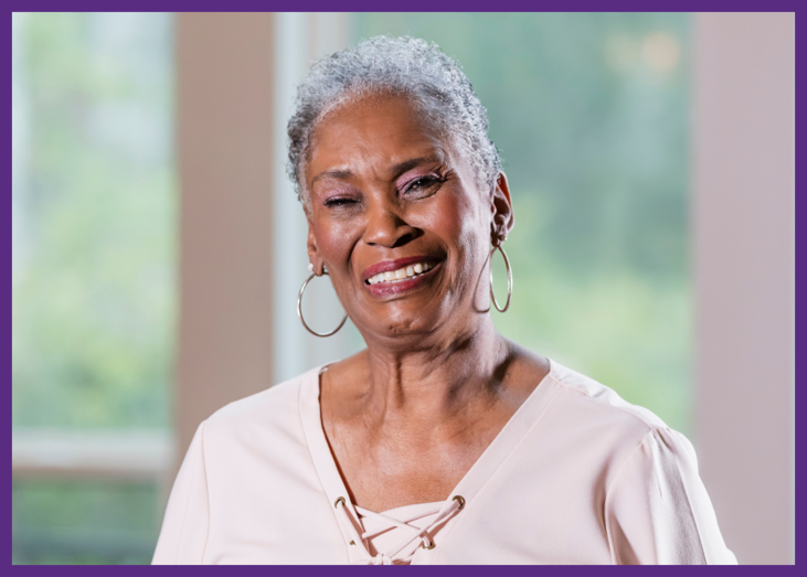 photo of a smiling senior woman, blurred background 
