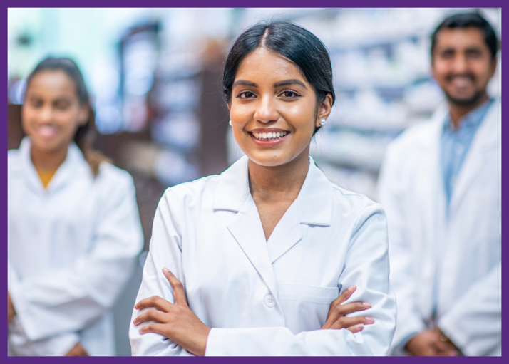 photo of 3 pharmacists standing in a pharmacy 
